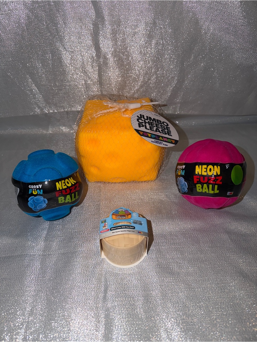 One Squishy Dumpling, One Squishy Cheese & Two Neon Fuzz Balls